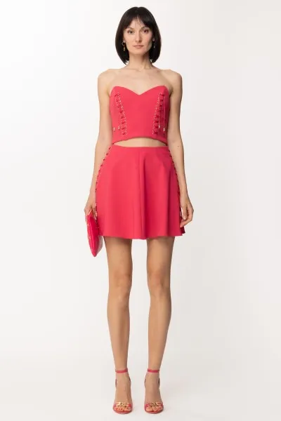 Minigonna svasata con criss-cross Fuxia